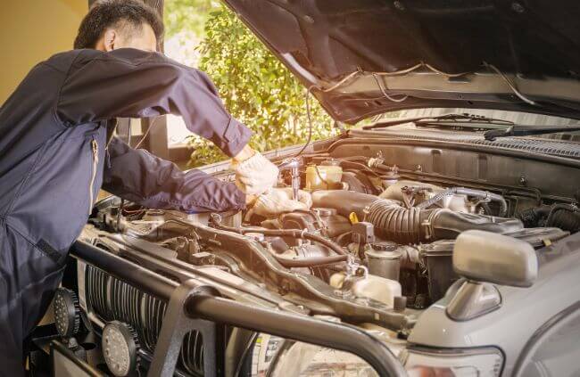 Mobile car mechanic in St Marys performing engine repairs on a vehicle outdoors