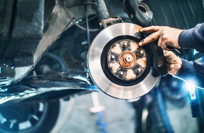 A mobile mechanic conducting a brake repair in Sydney