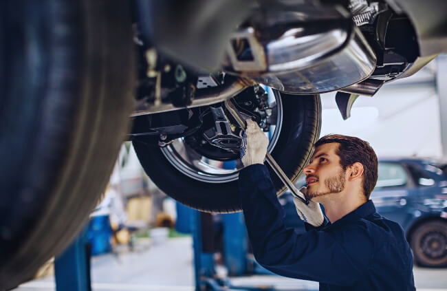 A professional mechanic fine-tunes the undercarriage for peak performance