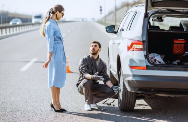 A skilled mobile mechanic in Merrylands assisting a driver with a roadside repair and needed urgent on-site vehicle service