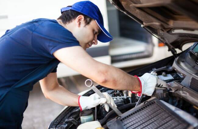 Expert mobile mechanic in Sydney completing car alternator repair and alternator replacement service under the bonnet