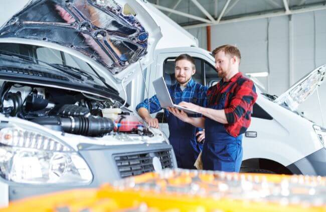 Mobile Mechanic Penrith fleet maintenance mechanics inspecting a work van engine during an on-site fleet servicing in Sydney