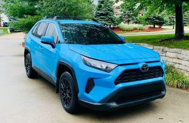 Blue Toyota SUV parked in a driveway after receiving mobile car tinting in Sydney by Mobile Mechanic Penrith, showing freshly tinted windows and a clean finish.